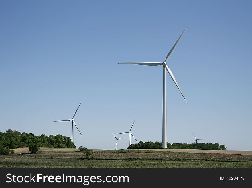 Wind turbine with grass in foreground. Wind turbine with grass in foreground