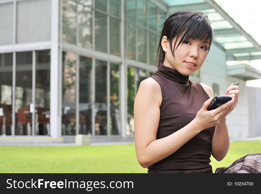 Beautiful young and modern Asian woman in the city.