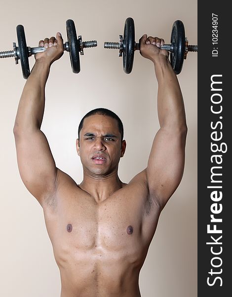 Muscular Male Body, Lifting Dumbbells