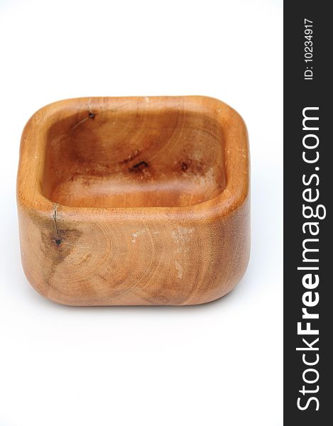 Shot of a square wooden bowl on white