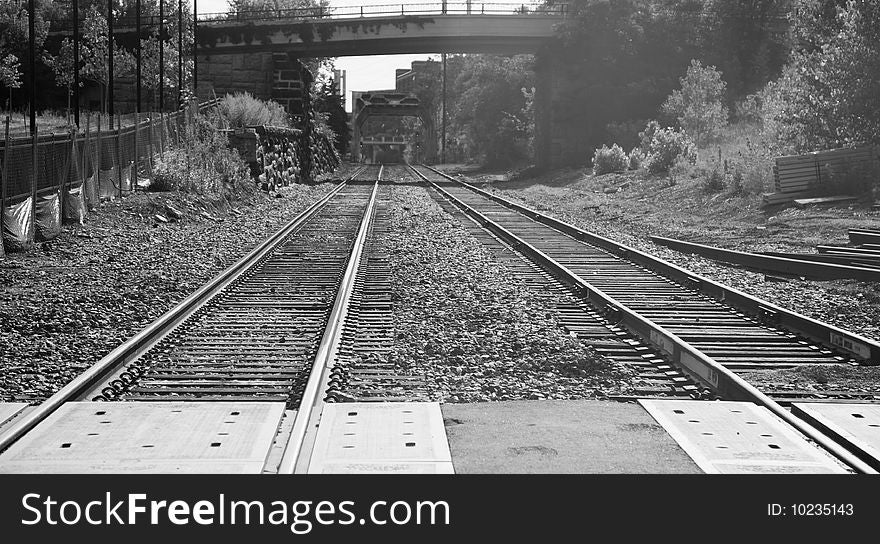 Railroad Tracks Under and then Over a Bridge