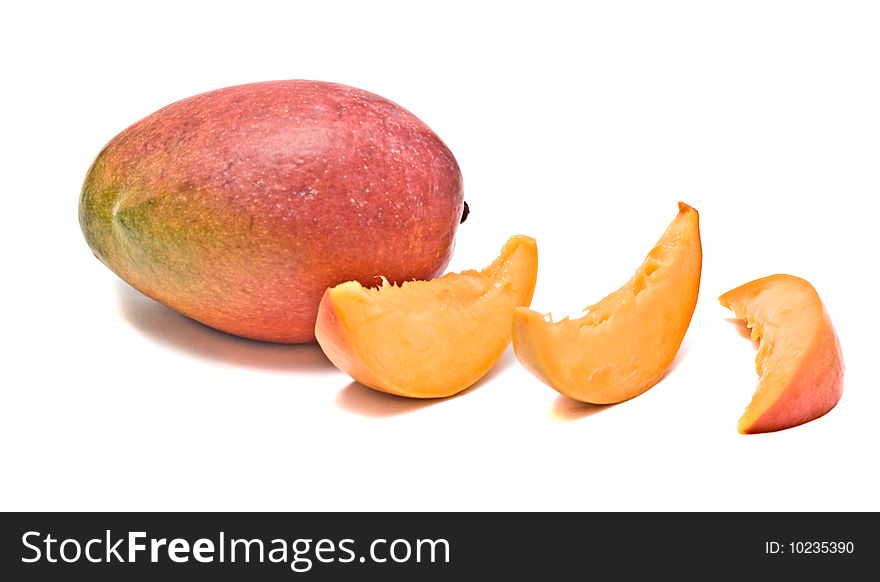 Mango and three segments isolated on white background