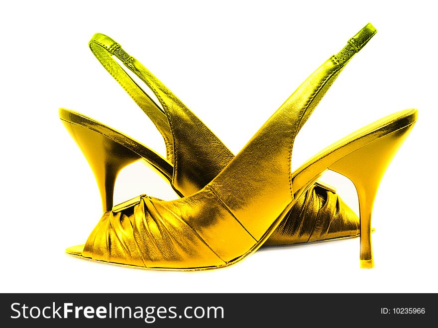 Gold shoe isolated on white