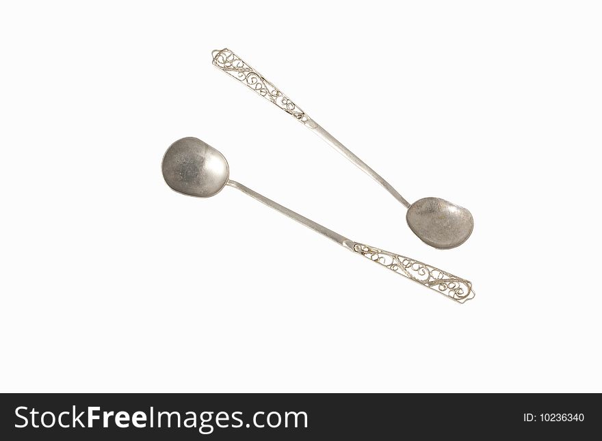 Old silver spoons isolated on white