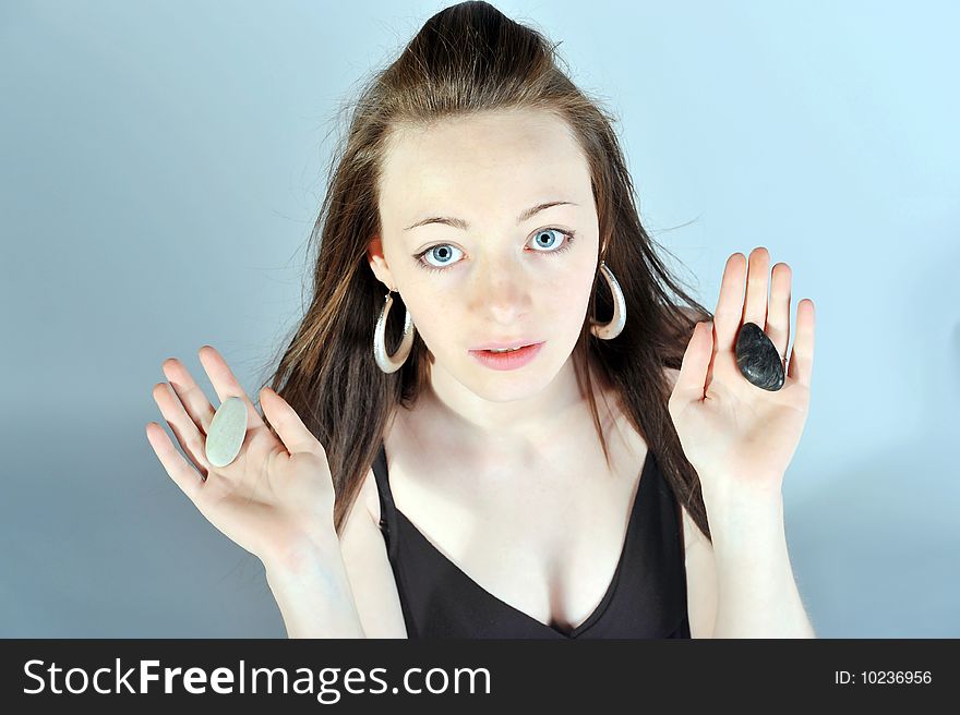 A girl choosing of black or white stone