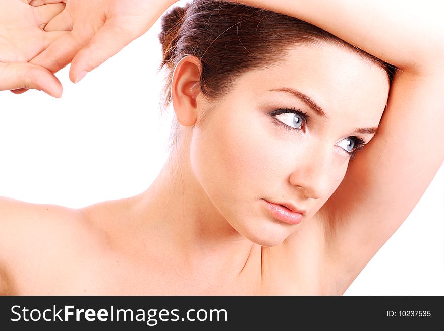 A beautiful young woman with her arms up in a contemplating pose. A beautiful young woman with her arms up in a contemplating pose.