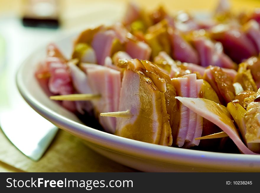 Pork shashlik in kitchen on white plate