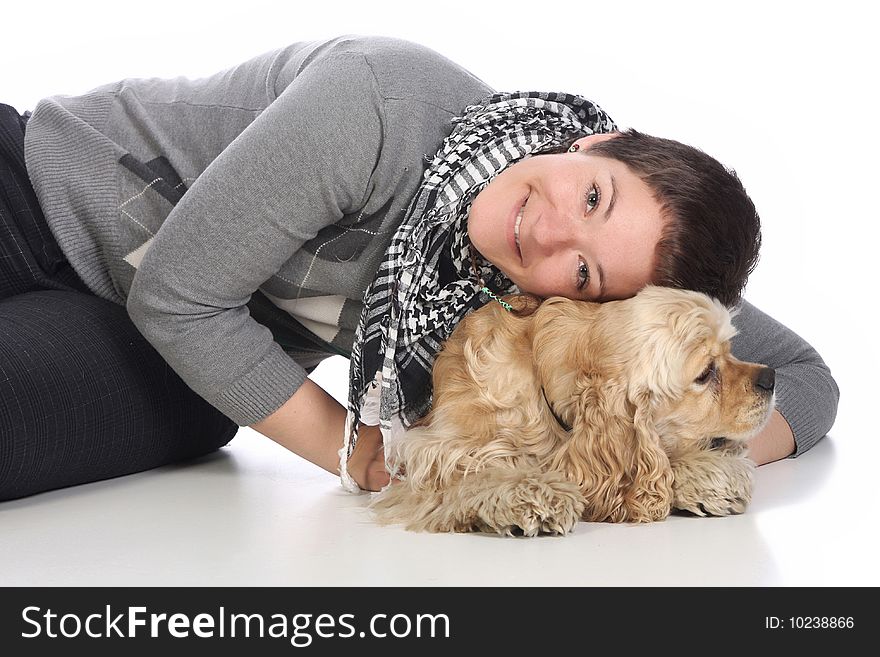 Girl and american cocker spaniel over a white background
