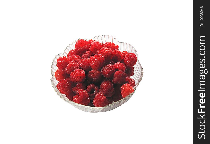 Raspberry on the glass plate, isolated on white