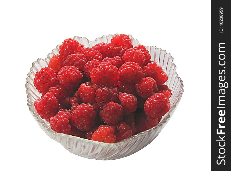Raspberry on the glass plate, isolated on white