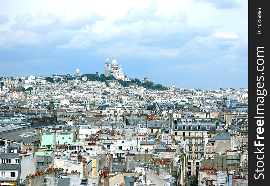 View of Parisian rooftops --- Sacred Heart cathedral, Montmartre in the distance
