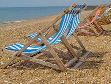 Deckchairs Lined Up On Beach. Stock Photography Deckchairs Lined Up On Beach. Stock Photography