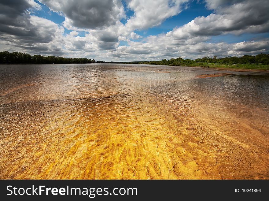 River panorama on a summer day with clouds and blue sky. River panorama on a summer day with clouds and blue sky