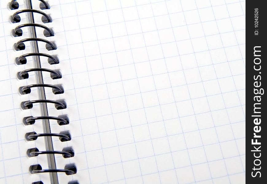An open spiral bound notebook with lined paper