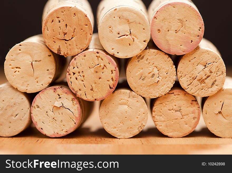 Stack of Wine Corks on a Wood Surface.