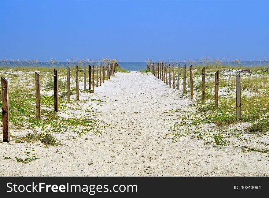 Path on the sand to the ocean