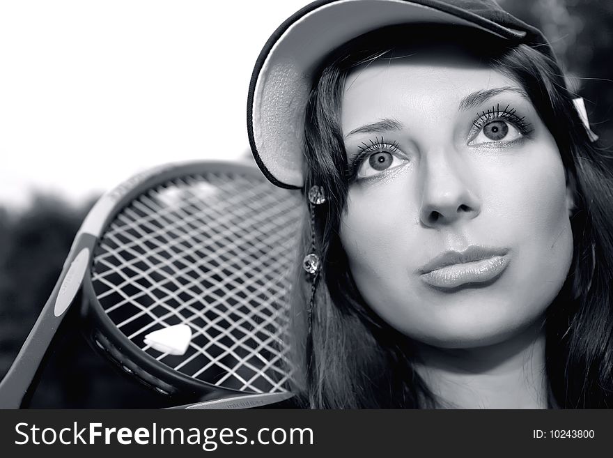 Pretty tennis player with racket in monochrome. Pretty tennis player with racket in monochrome