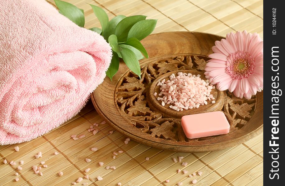 Spa concept. Towel, soap, bath salt and gerber.