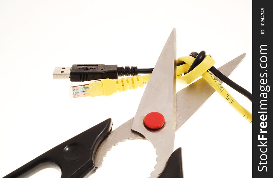 A pair of scissors about to cut the knot connecting a black usb cable and a yellow lan cable over a white background. A pair of scissors about to cut the knot connecting a black usb cable and a yellow lan cable over a white background.