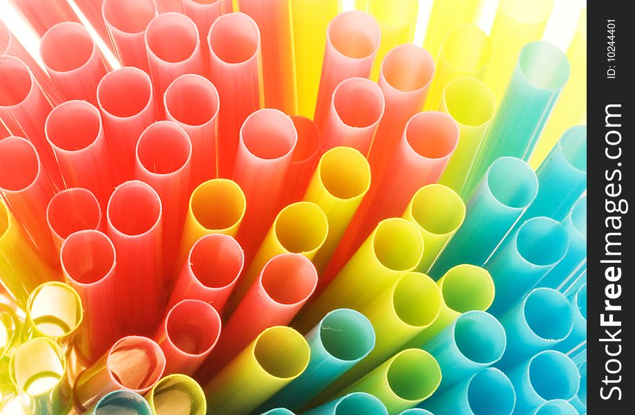 Detail of a bundle of drinking straws, lit from behind. Detail of a bundle of drinking straws, lit from behind.