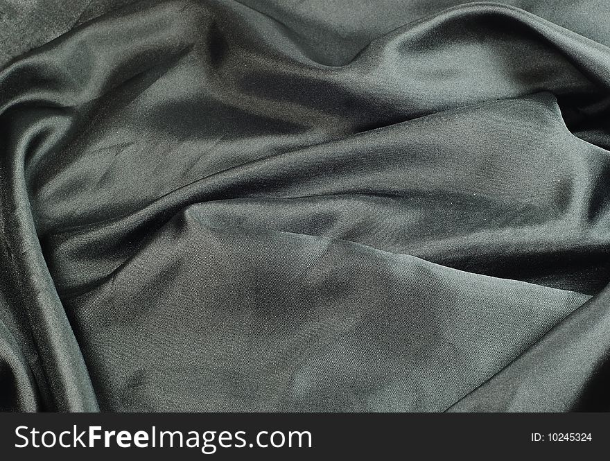 Closeup of beautiful black satin fabric