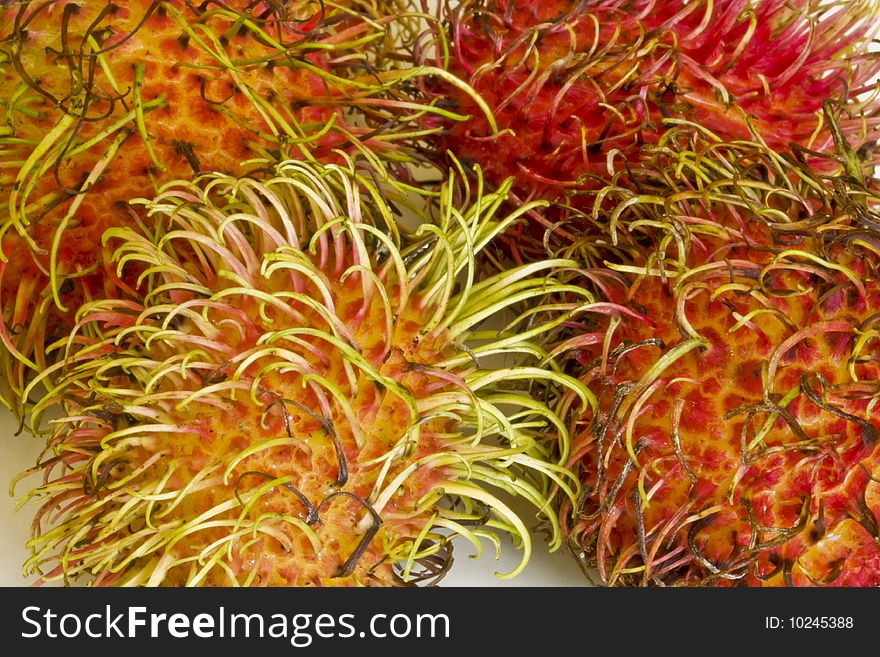 a closeup of an exotic  spinky ramutan fruit