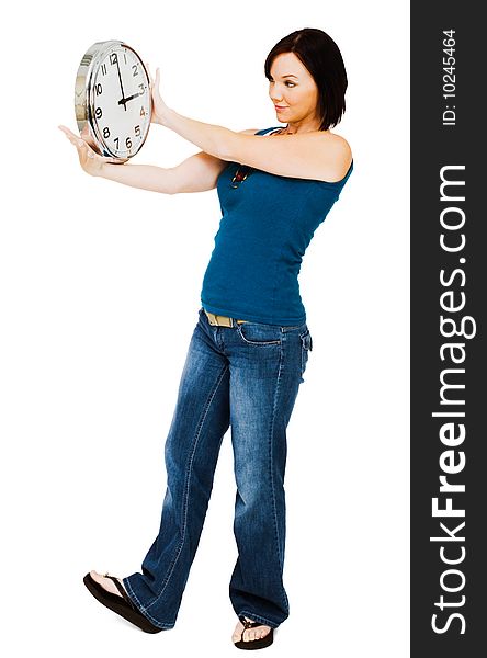 Young woman holding a clock isolated over white. Young woman holding a clock isolated over white