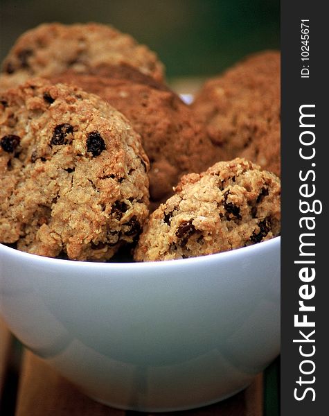 Mix of rasin and chocolate cookies in a bowl. Mix of rasin and chocolate cookies in a bowl