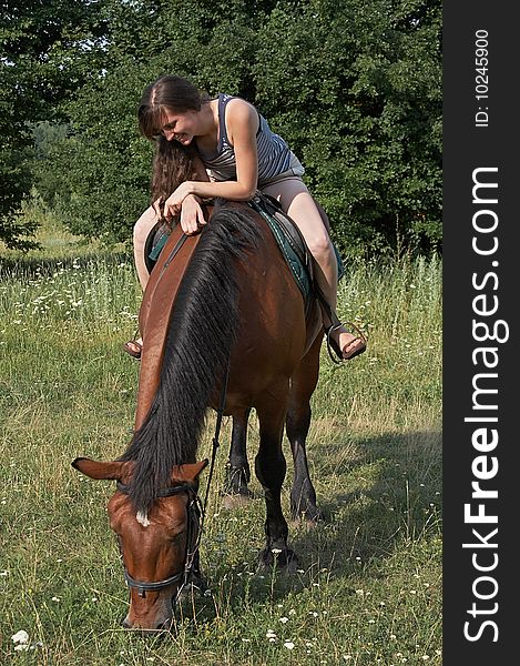 Girl Sits On Horseback