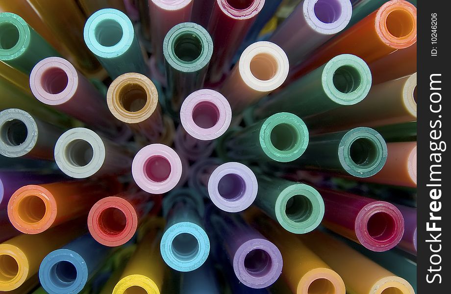 A display of coloured pens viewed end-on. A display of coloured pens viewed end-on.