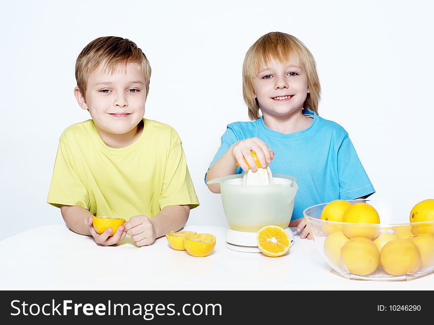 Children squeeze out orange juice Isolated