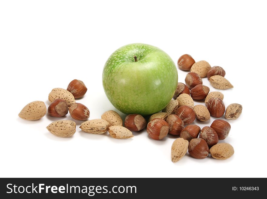 Apple with almonds and hazelnuts, isolated on white. Apple with almonds and hazelnuts, isolated on white