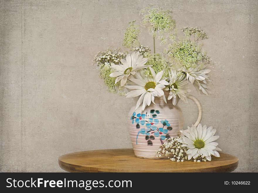 Daisies and Queen Anne's Lace in an old pitcher. Daisies and Queen Anne's Lace in an old pitcher.