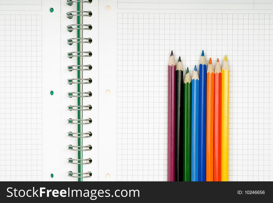 Close up of notebook and pencil on white background with clipping path