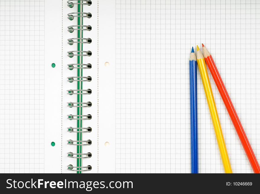 Close up of notebook and pencil on white background with clipping path