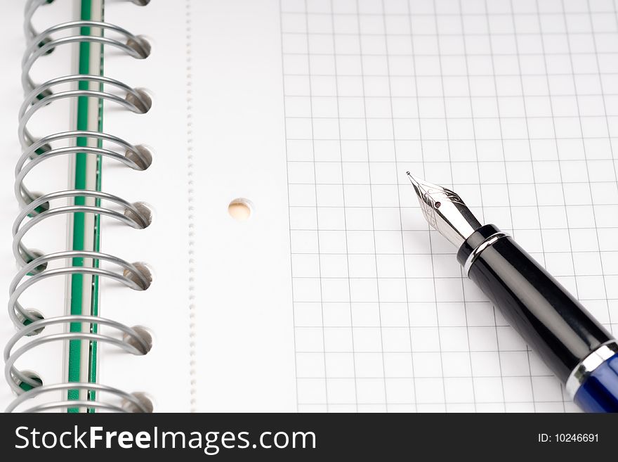 Close up of notebook and pencil on white background with clipping path