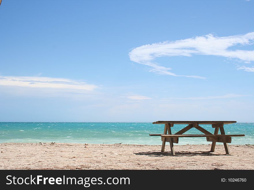 A bench on a beach in Key West, Florida. A bench on a beach in Key West, Florida