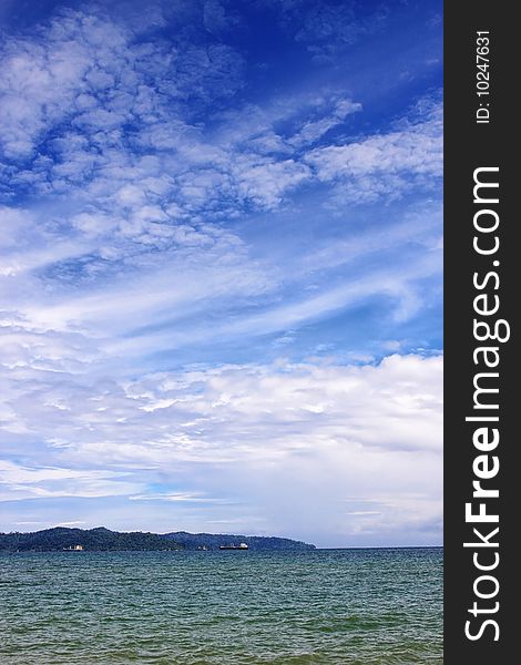 View of the beach on cloudy sunny day.