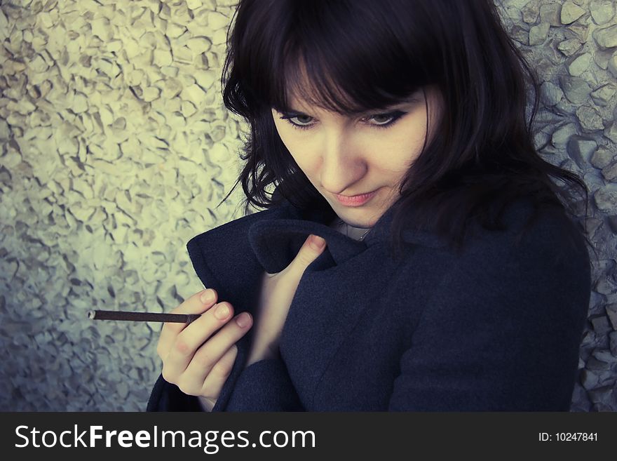 Portrait of young woman with  cigarette