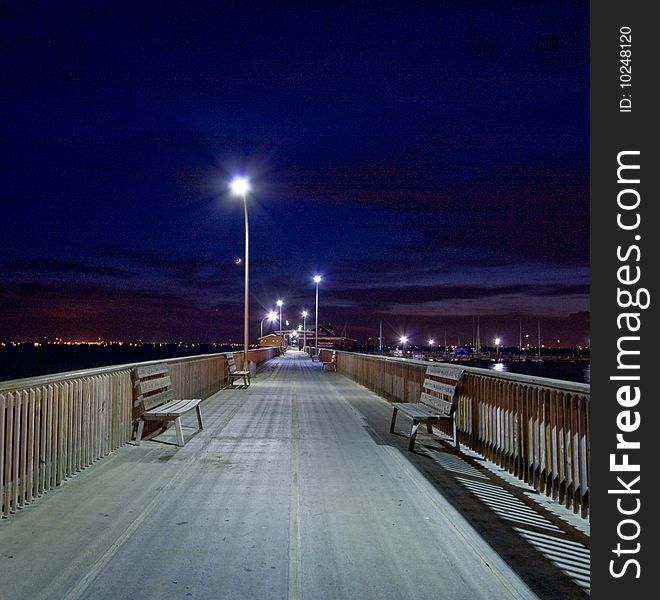 Beautiful colors in the night time sky behind this pier. Beautiful colors in the night time sky behind this pier