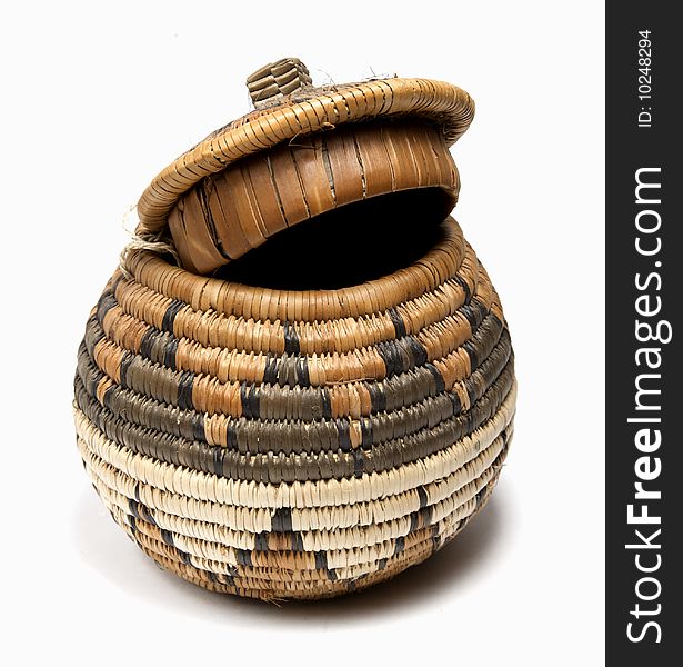 Woven brown traditional basket with lid open. Woven brown traditional basket with lid open
