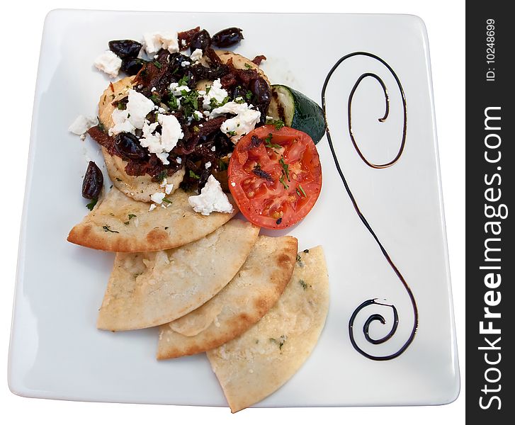 Plate of pasta with tomato, olives, bread and feta cheese isolated with clipping path. Plate of pasta with tomato, olives, bread and feta cheese isolated with clipping path