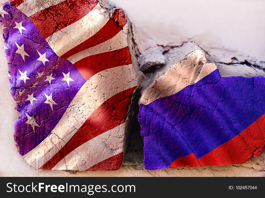 Symbol of crisis relations between countries. Square log wood with flags of USA and Russia