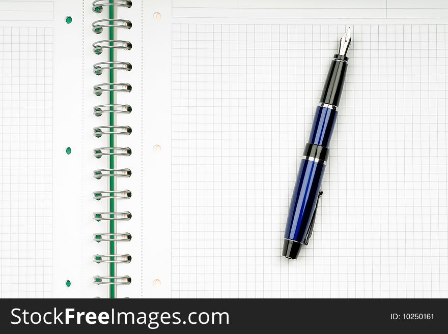 Close up of notebook and pencil on white background with clipping path