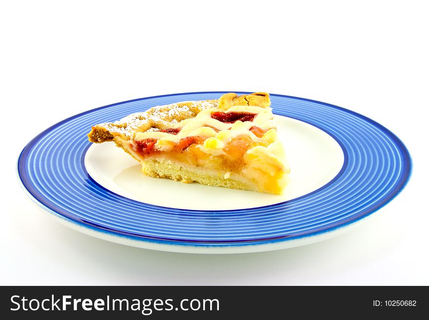 Slice of apple and strawberry pie on a blue plate on a white background