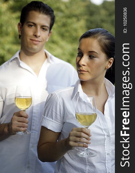 Young couple with glas of wine outdoor