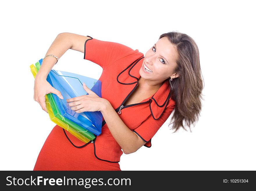 The young beautiful businesswoman at office behind work on a white background. The young beautiful businesswoman at office behind work on a white background