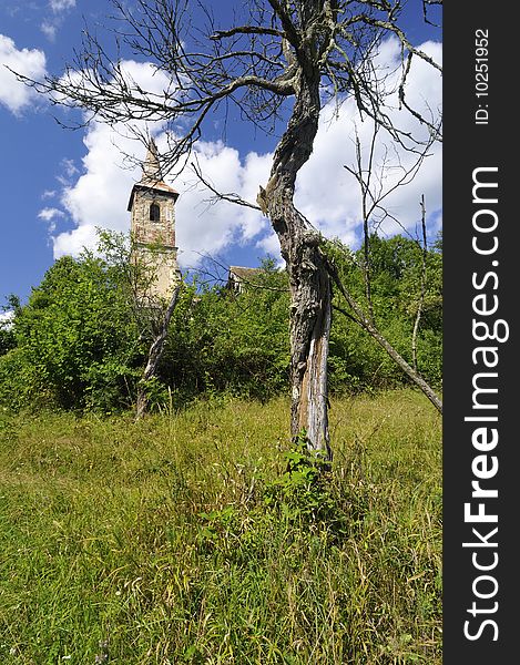 Old Catholic church on a hill near the village. Old Catholic church on a hill near the village