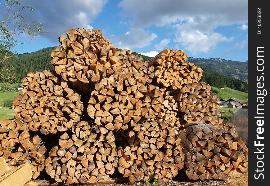 Lots pile of woods in Gosau village , a beautiful village in salzkammergut of Austria. Lots pile of woods in Gosau village , a beautiful village in salzkammergut of Austria.