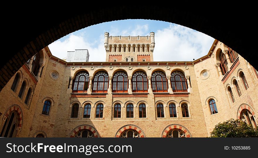 Neo-Byzantine building seen through the archway